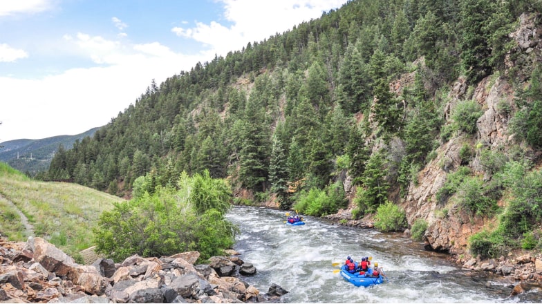 outdoor recreation raft floating down a mountain river